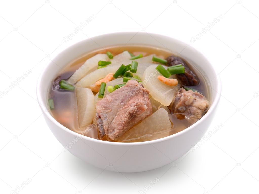 soup radish with pork serve on bowl, thai food isolated on white