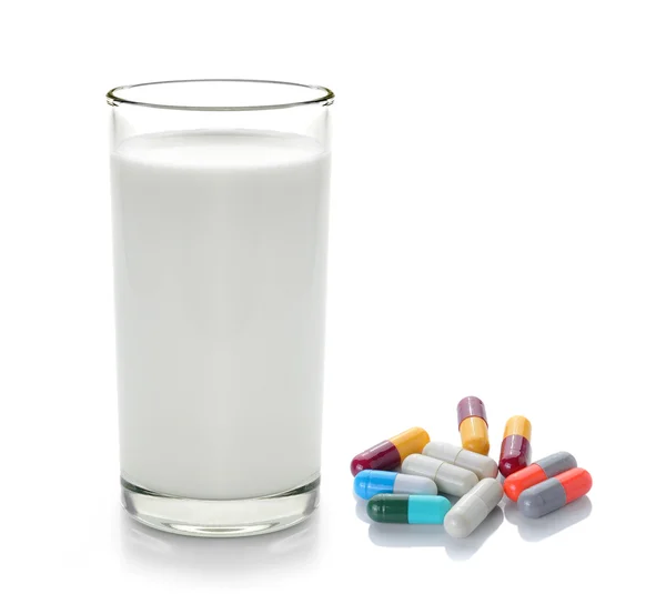 Pill and glass of milk isolated on white background — Stock Photo, Image