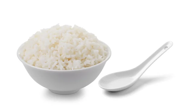 Bowl full of rice and spoon on white background — Stock Photo, Image