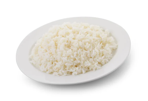 Arroz cozido em uma placa branca no fundo branco — Fotografia de Stock