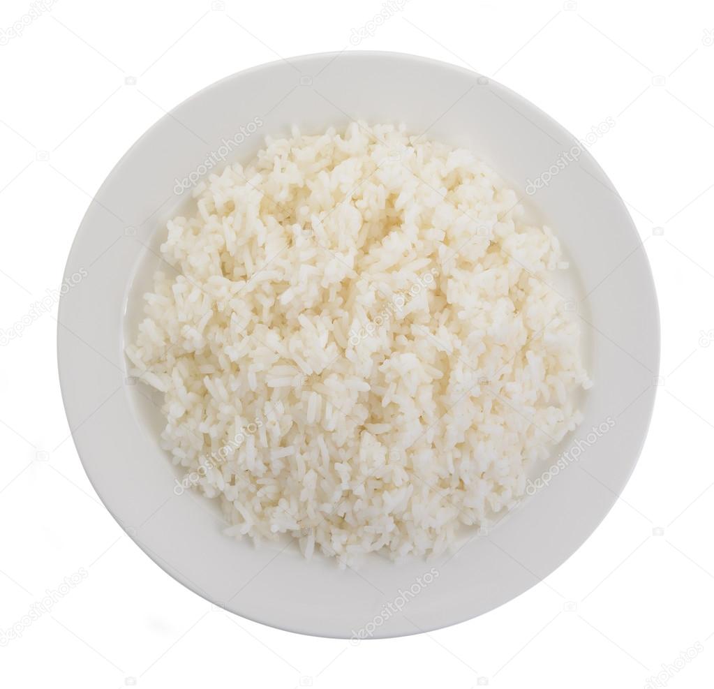 Cooked rice in a white plate on white background Stock Photo by