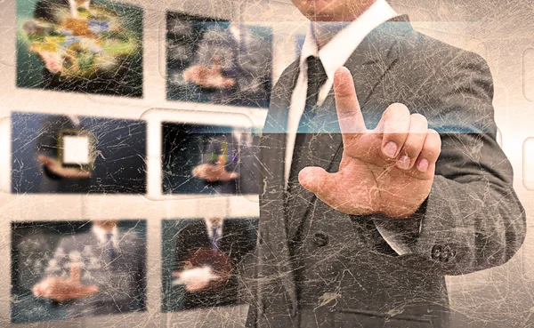 Businessman hand pushing button on a touch screen interface in t — Stock Photo, Image