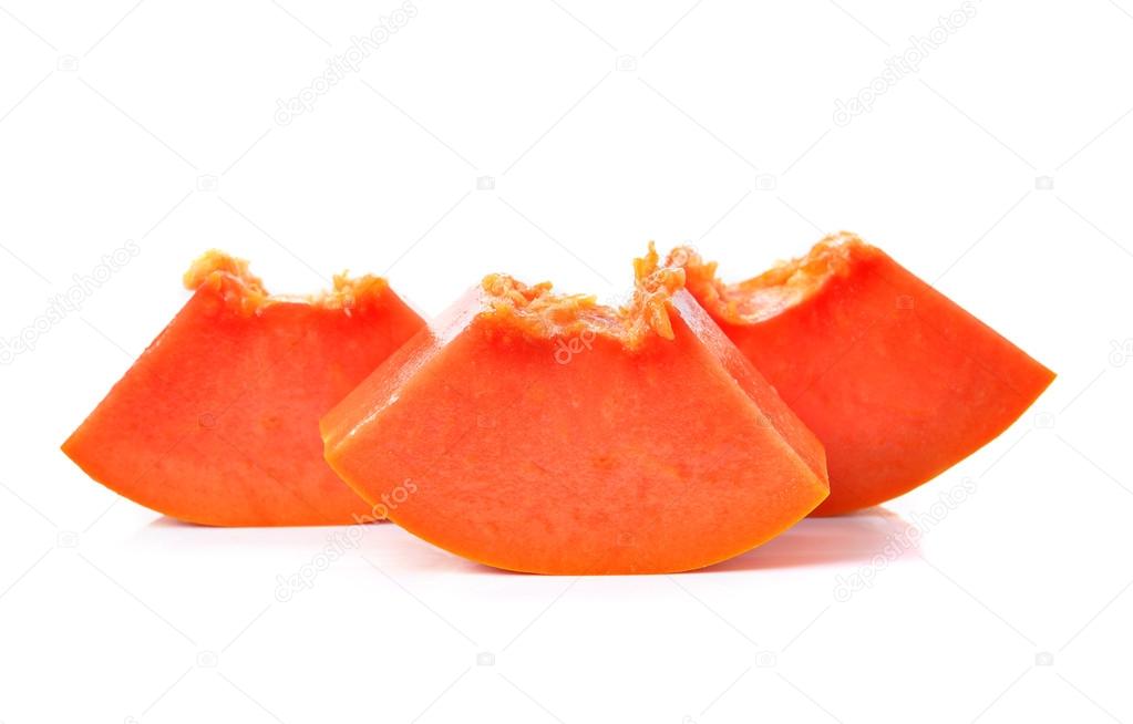 sliced papaya on a white background