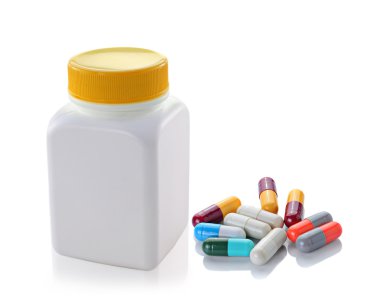pills out of bottle on white background clipart