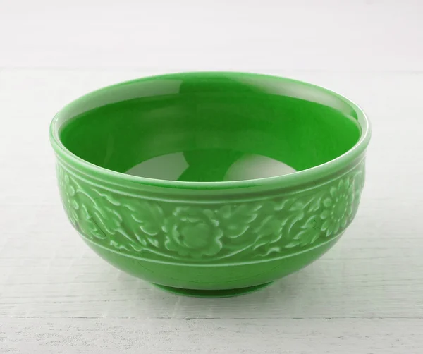 Empty ceramic bowl on wood — Stock Photo, Image