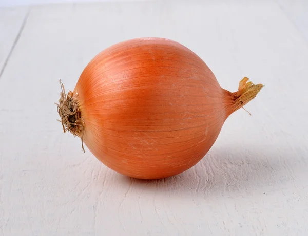 Onion on wooden — Stock Photo, Image
