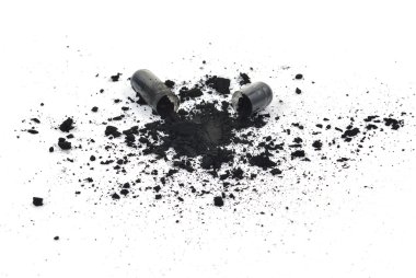 Charcoal capsules isolated on white background clipart