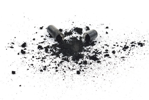 Charcoal capsules isolated on white background