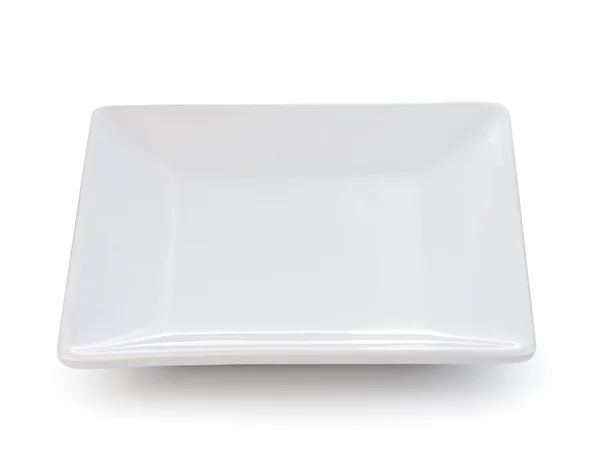 Placa de cerámica vacía sobre un fondo blanco — Foto de Stock