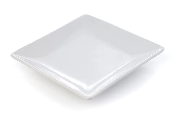 Leerer weißer Teller auf weißem Hintergrund — Stockfoto