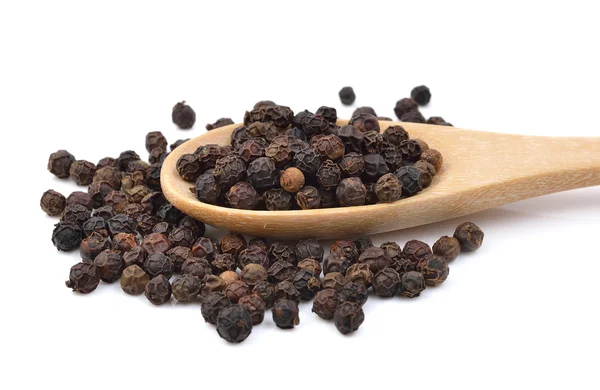 Black pepper in wooden spoon on white background. — Stock Photo, Image