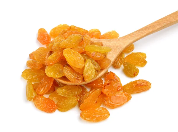 Dried raisins in the wood spoon on a white background — Stock Photo, Image