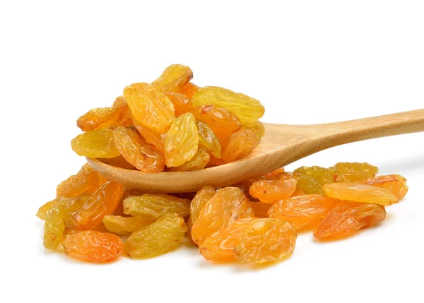 Dried raisins in the wood spoon on a white background — Stock Photo, Image