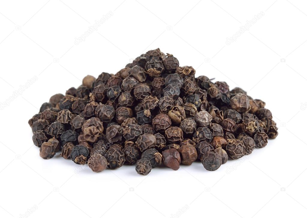 Black pepper seeds on white background