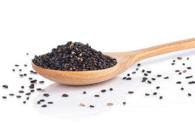 beyaz zemin üzerine kaşık susam