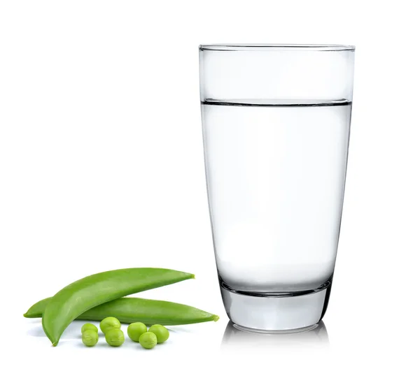 Water with fresh peas on white background — Stock Photo, Image