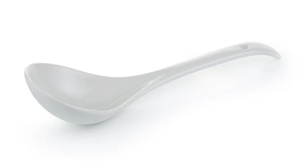 Colher de cerâmica vazia branca no fundo branco — Fotografia de Stock