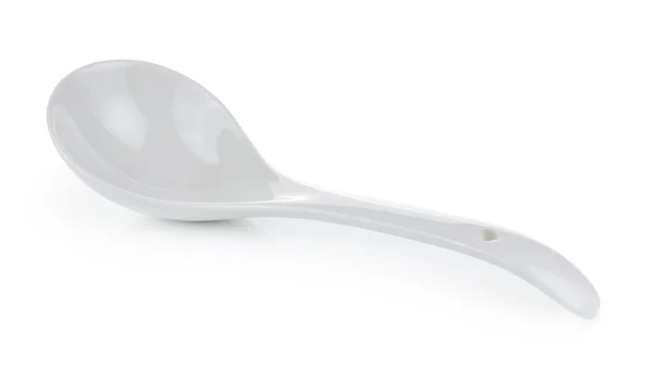 White empty ceramic spoon on white background — Stock Photo, Image