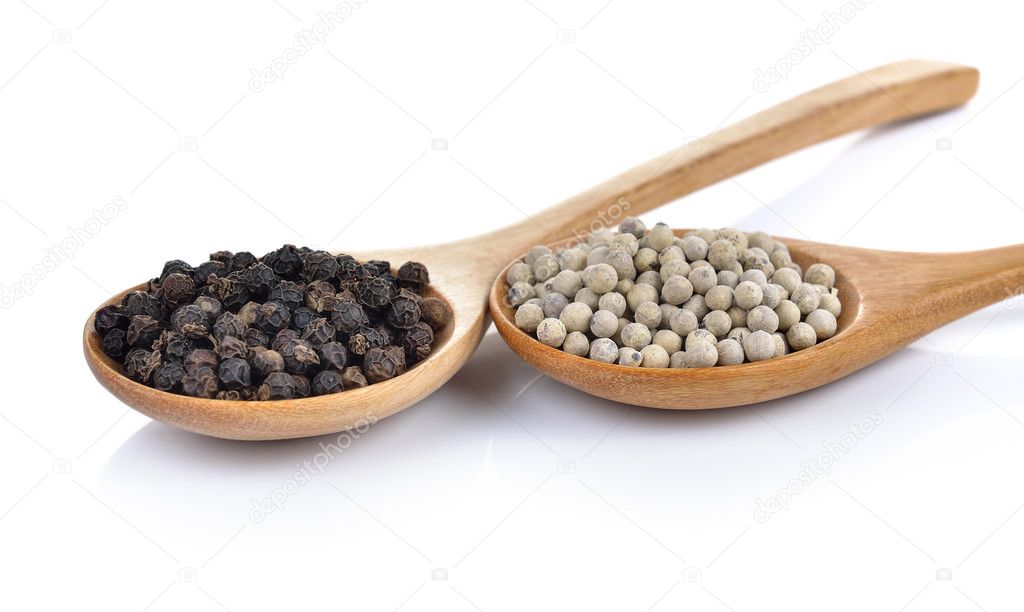 peppercorn in the wooden spoon on white background