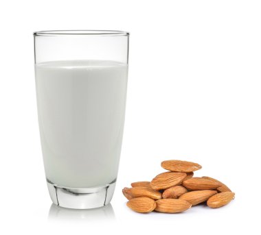almonds and milk on a white wooden background