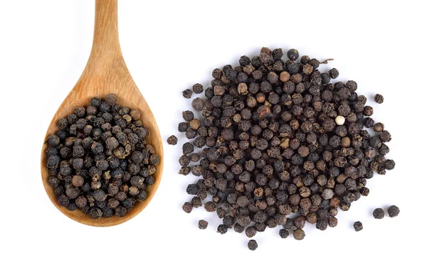 Wooden spoon and black peppercorn on white background — Stock Photo, Image