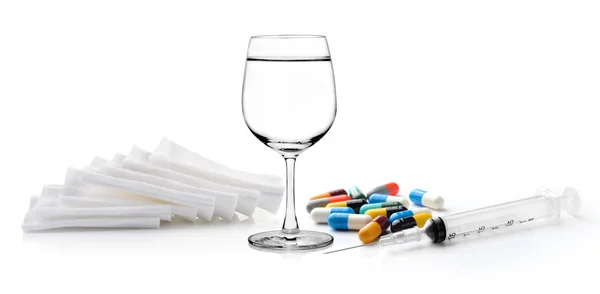 Glass of water  syringe pill and Cotton bandage on white backgro — Stock Photo, Image