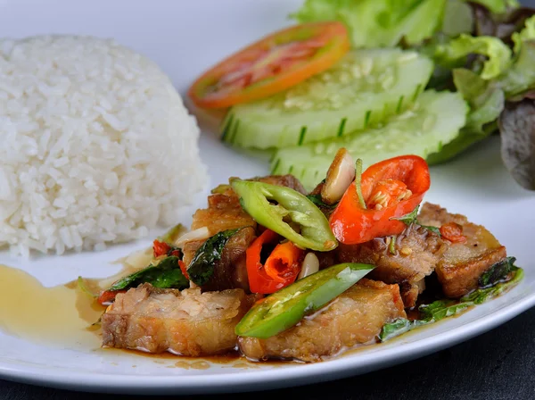 Rice topped with stir-fried pork and basil — Stock Photo, Image