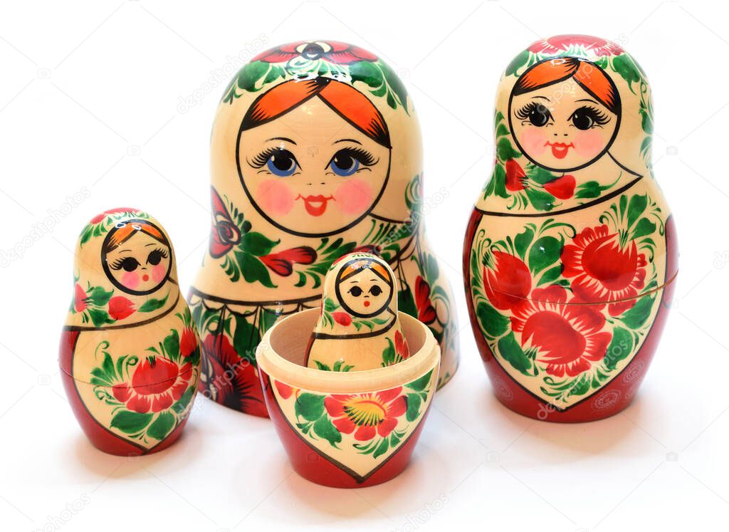 Several disassembled and assembled nesting dolls are shown in close-up