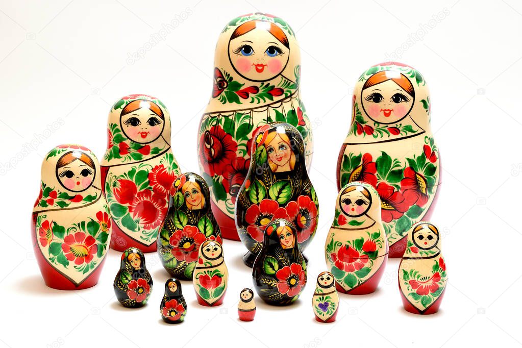 Two multi-colored sets of Russian nesting dolls lined up across the entire plane of the image.