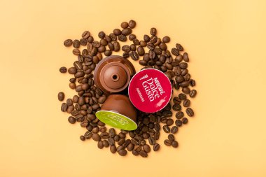 January 2021,Milan, Italy Set of Nescafe Dolce Gusto coffee capsules isolated on white background Top view Flat lay Drink obtained from dosed capsule with roasted, ground, compressed natural coffee. clipart