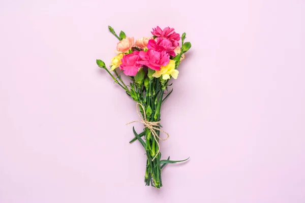 bouquet of pink carnation flower isolated on pink background Top view Flat lay Holiday card 8 March, Happy Valentines day, Mothers, Memorial, Teachers day concept Copy space