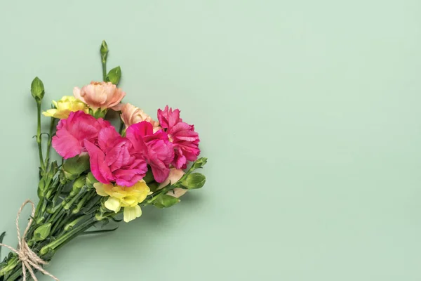 bouquet of pink carnation flower isolated on green background Top view Flat lay Holiday card 8 March, Happy Valentines day, Mothers, Memorial, Teachers day concept Copy space