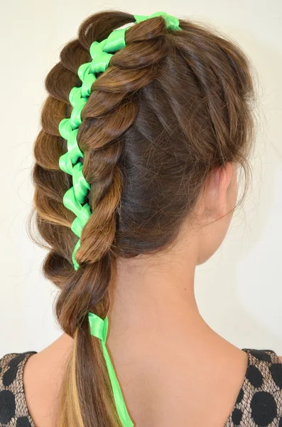 Hair weave with green ribbon