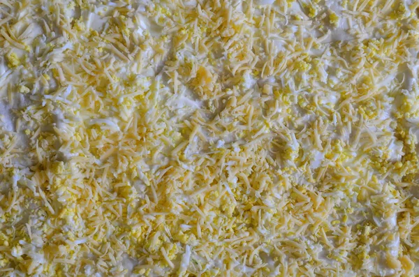 Achtergrond - de voedsel, geraspte kaas en een gekookt ei — Stockfoto