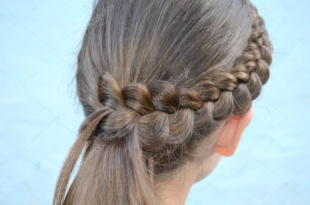 Hairstyle with a French braid Stock Photo by ©YuliyaM 74377583