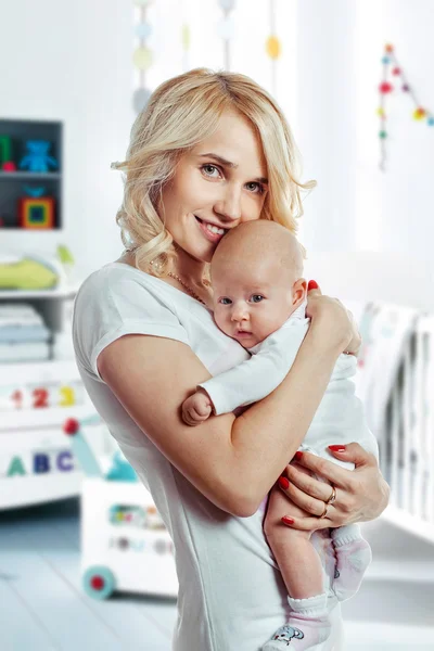 Happy loving mother and girl cuddling. — Stock Photo, Image