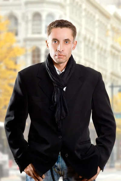 Serious man in black coat — Stock Photo, Image