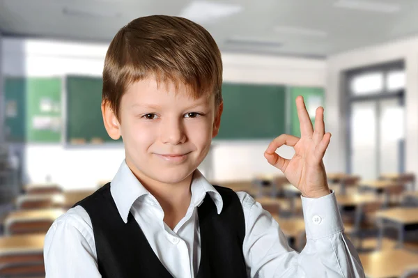 Schoolboy showing ok sign — Stock Photo, Image