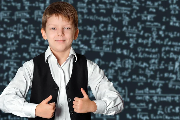 Schoolboy at the blackboard — Stock Photo, Image