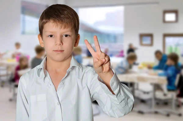 Boy making victory sign — Stock Photo, Image