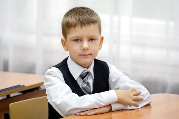 Pupil at a desk — Stock Photo, Image