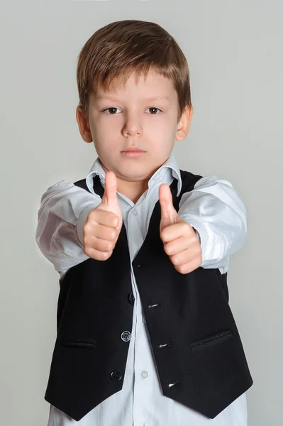 Boy giving thumbs up sign — Stock Photo, Image