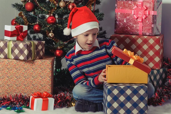 Happy boy opening a present box Stock Image