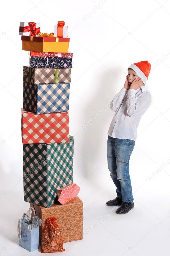 surprised boy and christmas presents