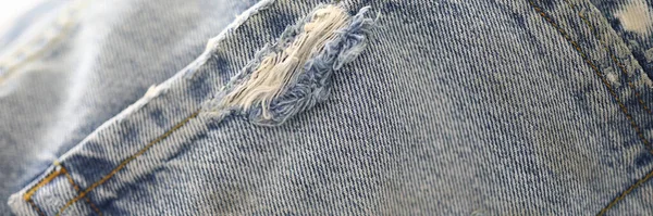 Back pocket of jeans with frayed and thread. — Stock Photo, Image