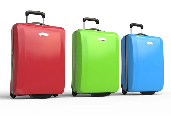 Red, green and blue polycarbonate travel baggage suitcases — Stock Photo, Image