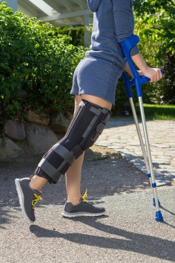 woman wearing a leg brace side view