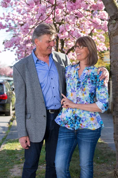 Affectionate Senior Couple Laughing Together Stand Close Embrace Looking Each — Stock Photo, Image