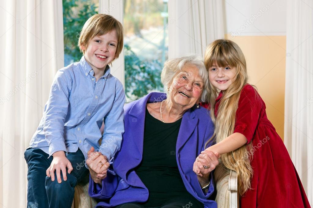 Attractive boy and girl with their grandmother.