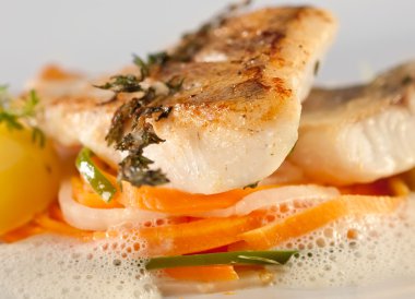 Fried pike perch with vegetables clipart